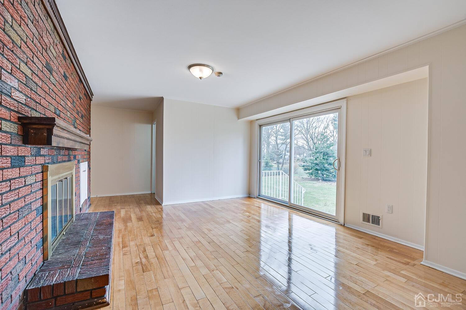 5 Robin Road Edison, NJ 08820 - Photo 16 of 43 a view of empty room with wooden floor and fan