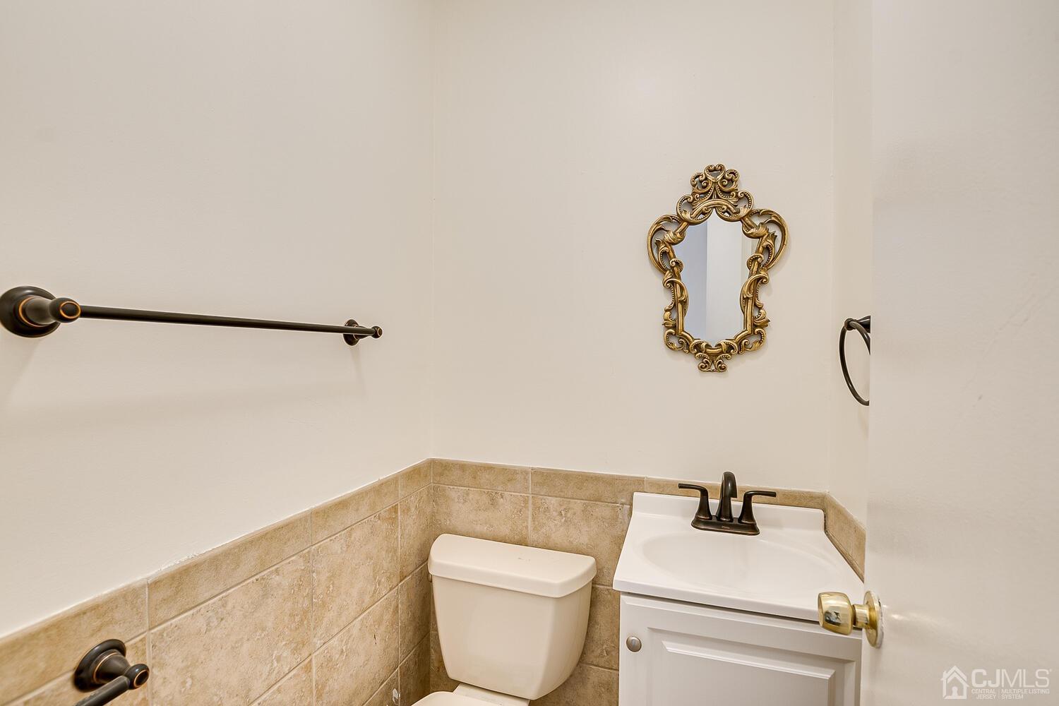 5 Robin Road Edison, NJ 08820 - Photo 17 of 43 a bathroom with a toilet and a sink
