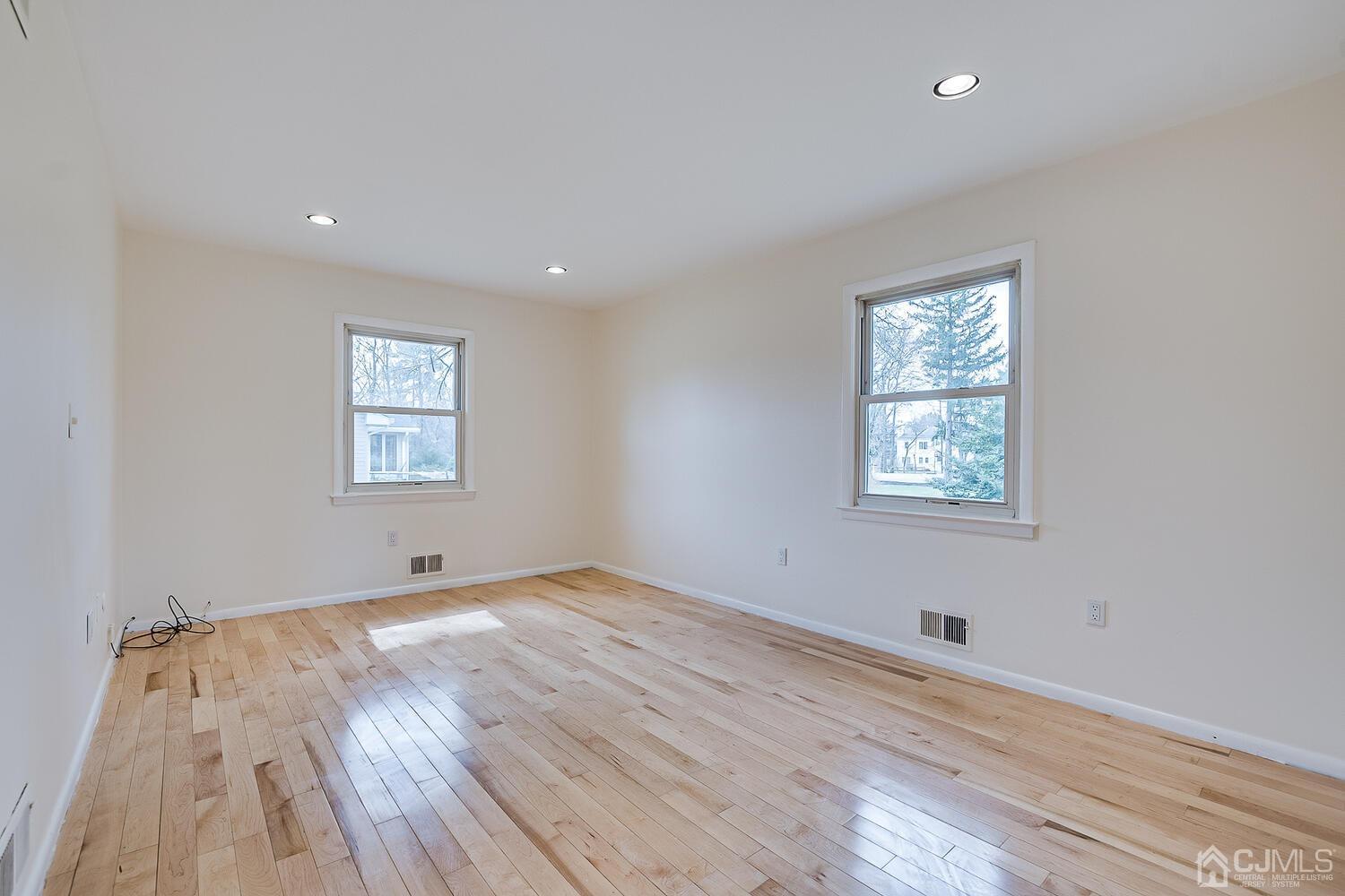 5 Robin Road Edison, NJ 08820 - Photo 18 of 43 an empty room with wooden floor and windows