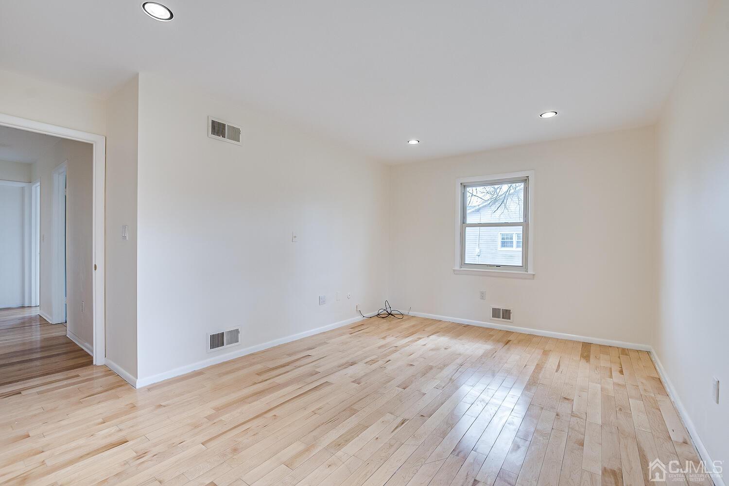 5 Robin Road Edison, NJ 08820 - Photo 19 of 43 wooden floor in an empty room with a window