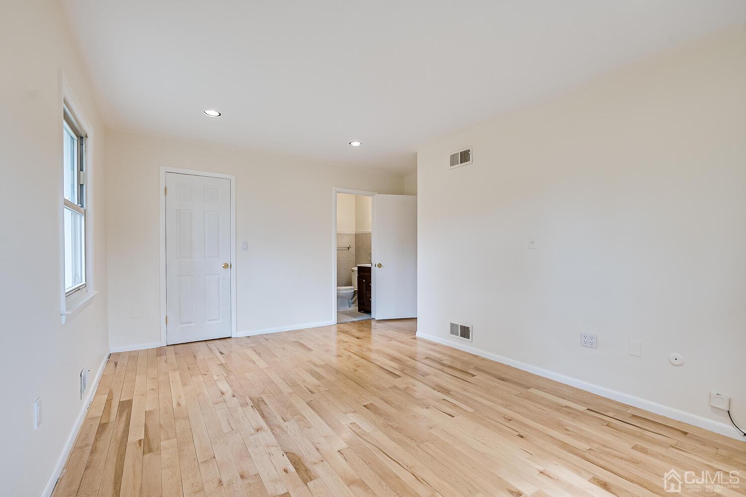 5 Robin Road Edison, NJ 08820 - Photo 20 of 43 a view of an empty room with wooden floor