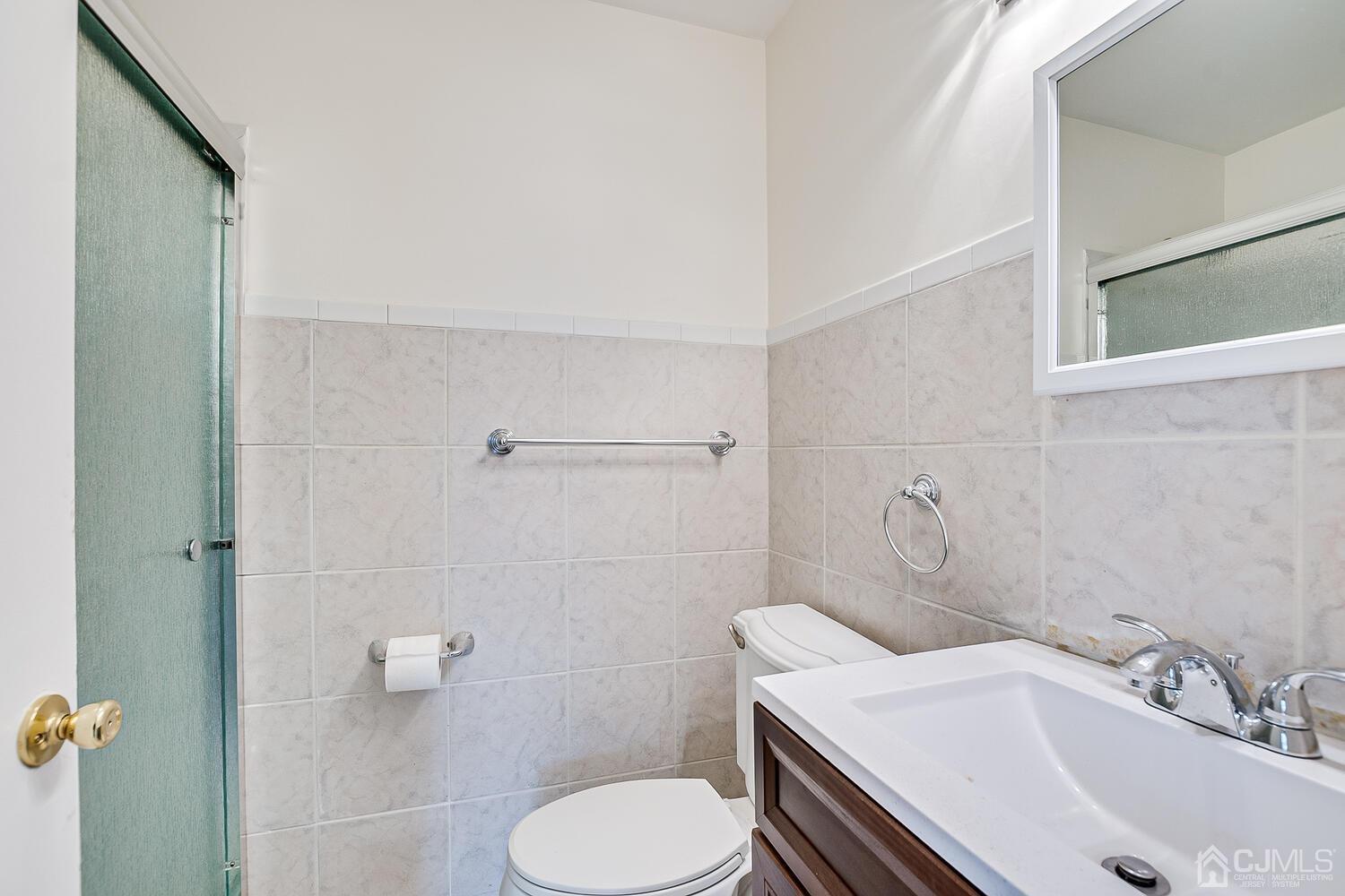 5 Robin Road Edison, NJ 08820 - Photo 21 of 43 a bathroom with a sink toilet and shower