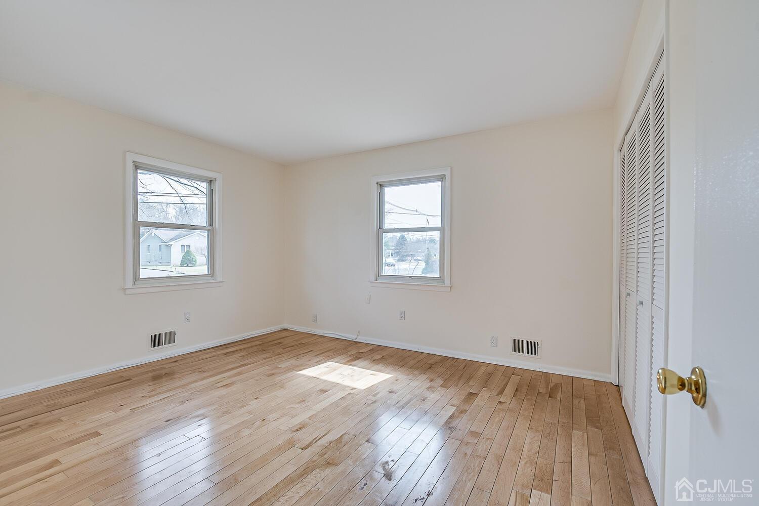 5 Robin Road Edison, NJ 08820 - Photo 23 of 43 an empty room with wooden floor and windows