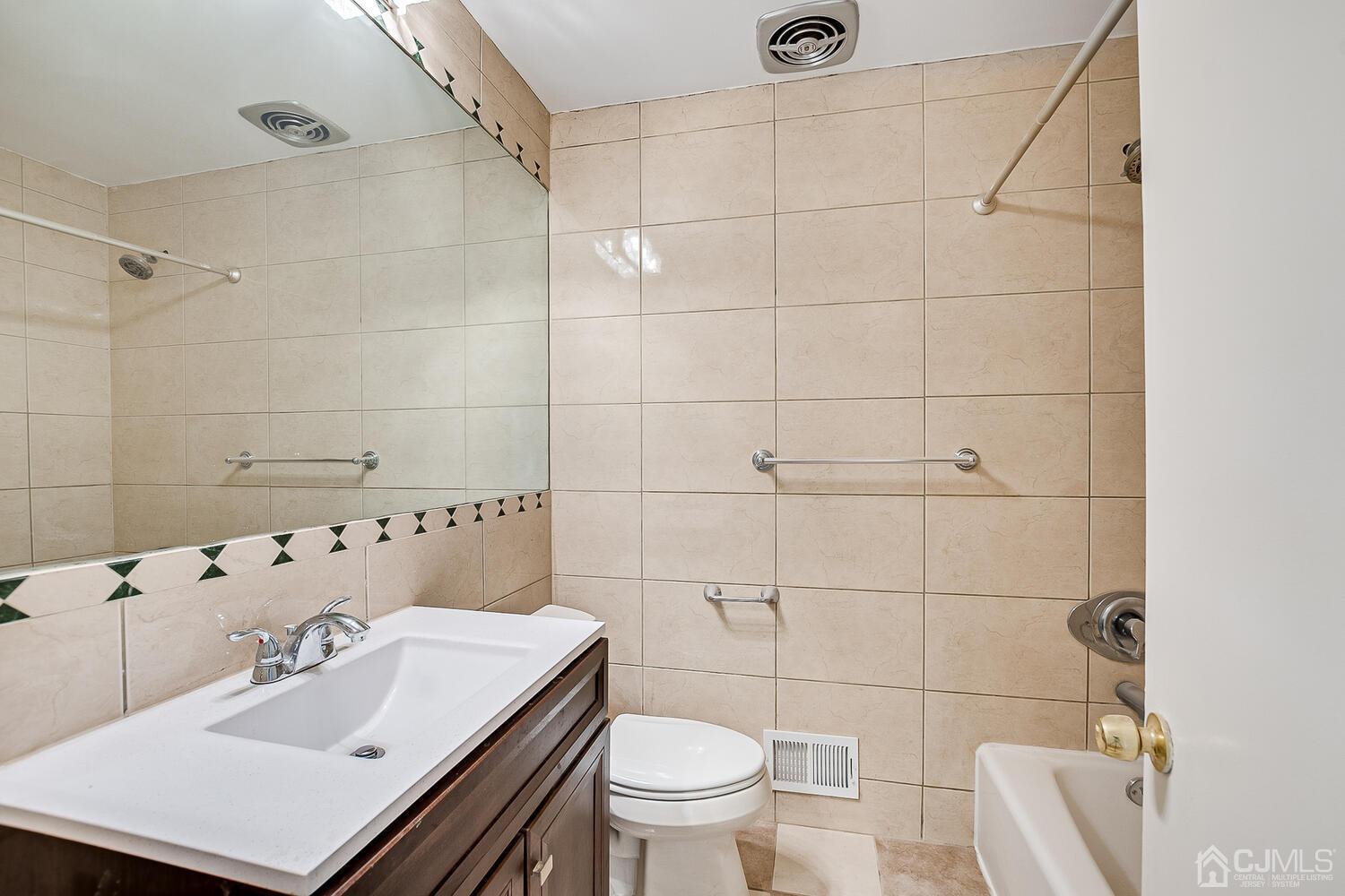 5 Robin Road Edison, NJ 08820 - Photo 25 of 43 a bathroom with a sink toilet and shower