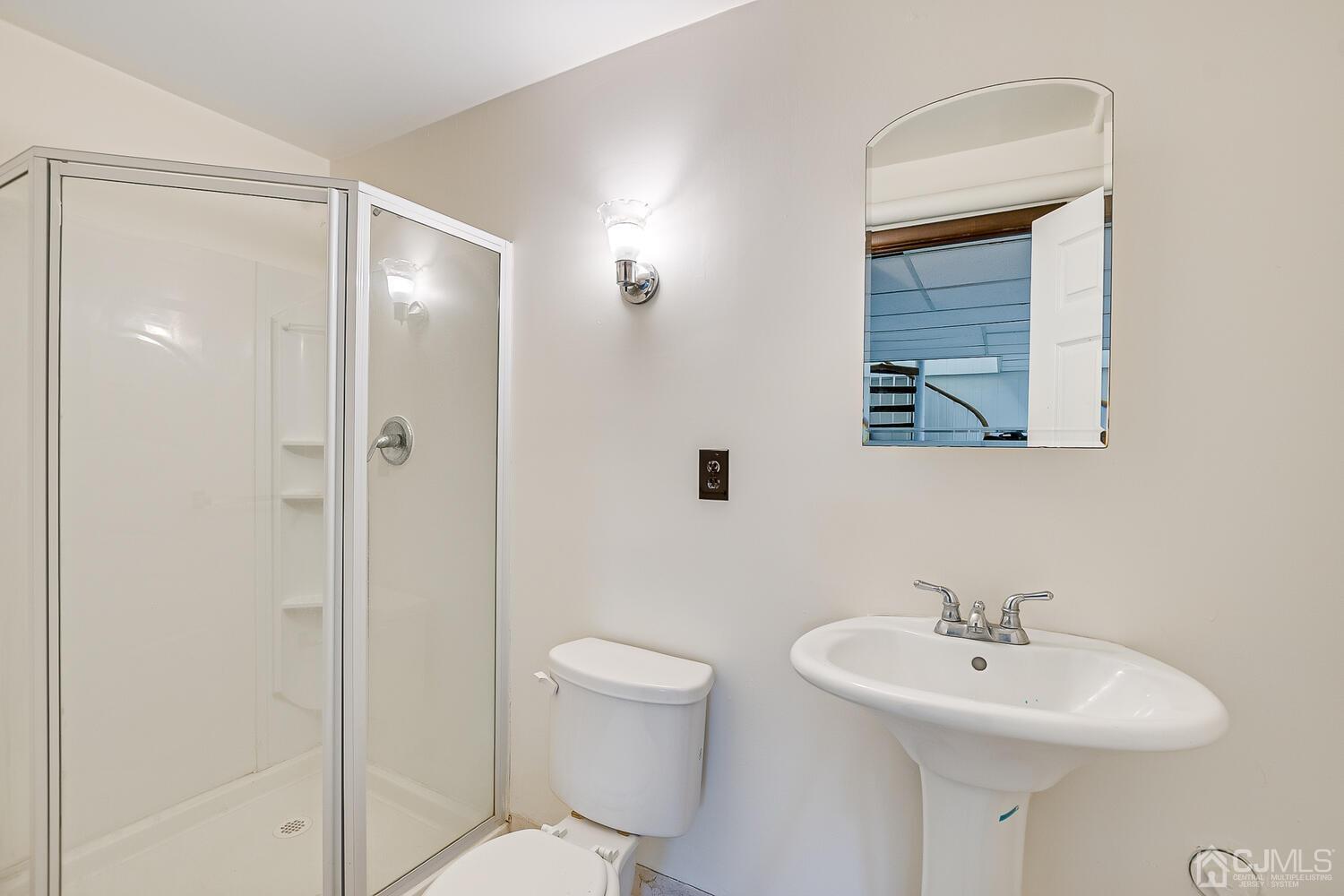 5 Robin Road Edison, NJ 08820 - Photo 30 of 43 a bathroom with a sink a toilet and shower