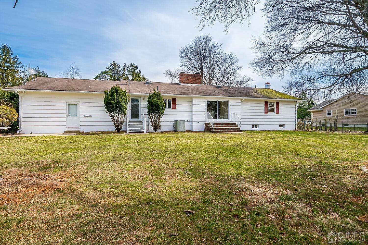 5 Robin Road Edison, NJ 08820 - Photo 32 of 43 a front view of house with yard and seating area