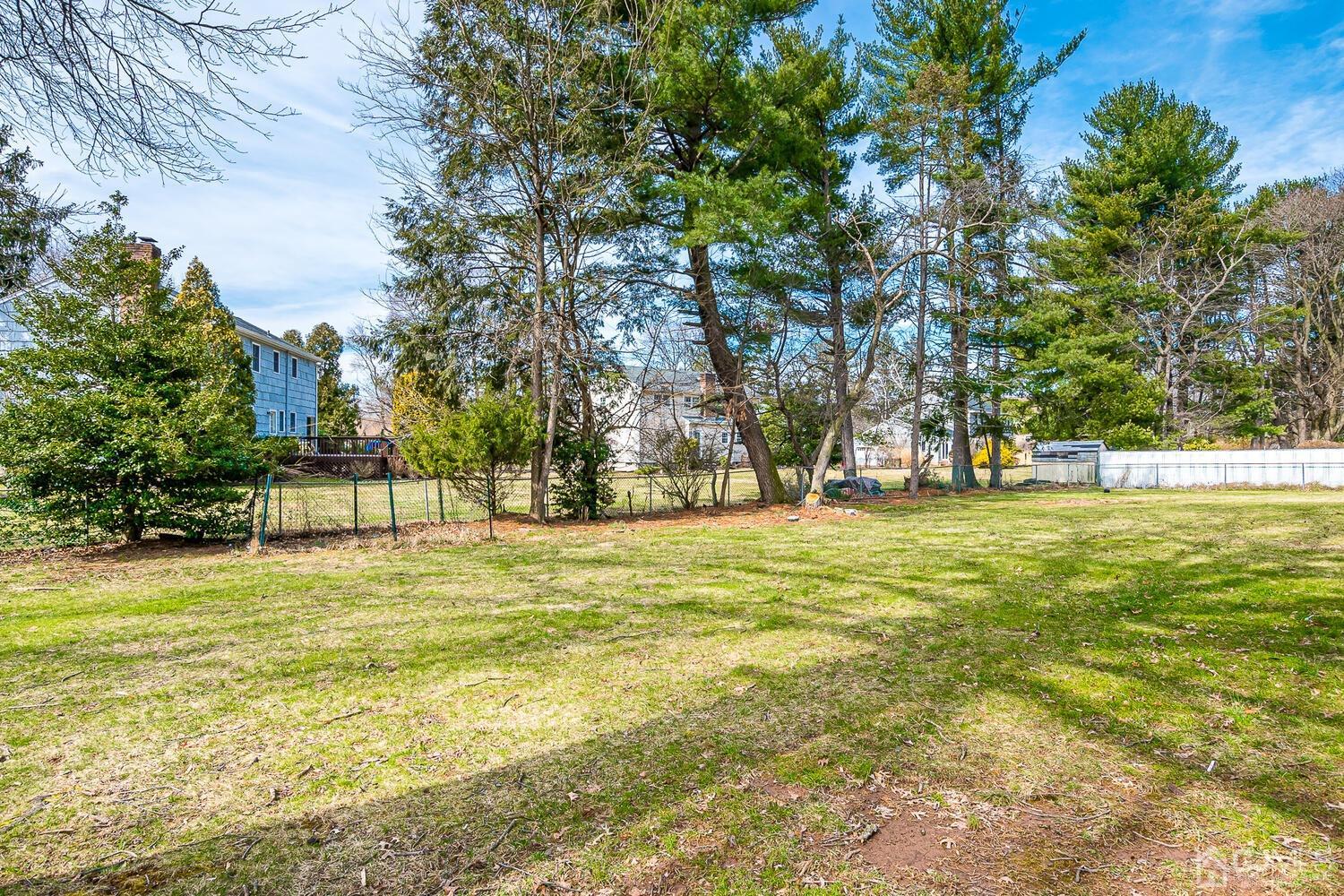 5 Robin Road Edison, NJ 08820 - Photo 34 of 43 a swimming pool with trees in the background