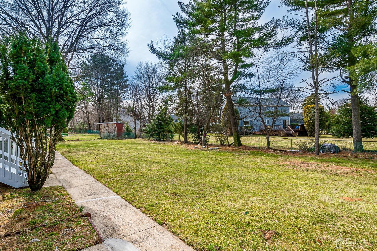 5 Robin Road Edison, NJ 08820 - Photo 35 of 43 a swimming pool with trees in the background
