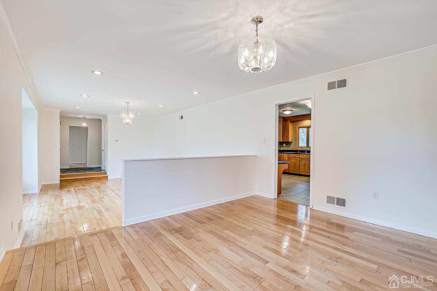5 Robin Road Edison, NJ 08820 - Photo 7 of 43 a view of empty room with wooden floor and fan
