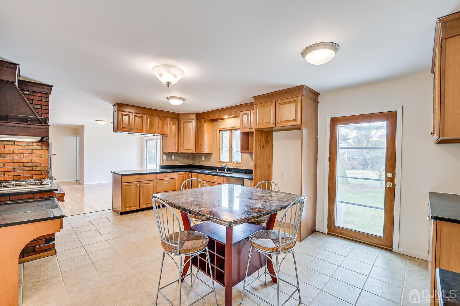 5 Robin Road Edison, NJ 08820 - Photo 9 of 43 a view of a dining room with furniture and a window
