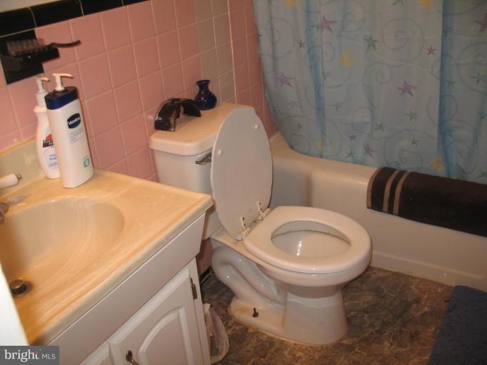 12409 Denley Road Silver Spring, MD 20906 - Photo 12 of 15 a bathroom with a sink and toilet