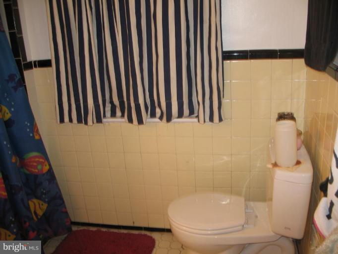 12409 Denley Road Silver Spring, MD 20906 - Photo 8 of 15 a bathroom with a toilet and a shower