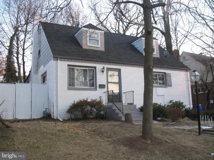 12409 Denley Road Silver Spring, MD 20906 - Photo 10 of 15 a front view of a house with a tree