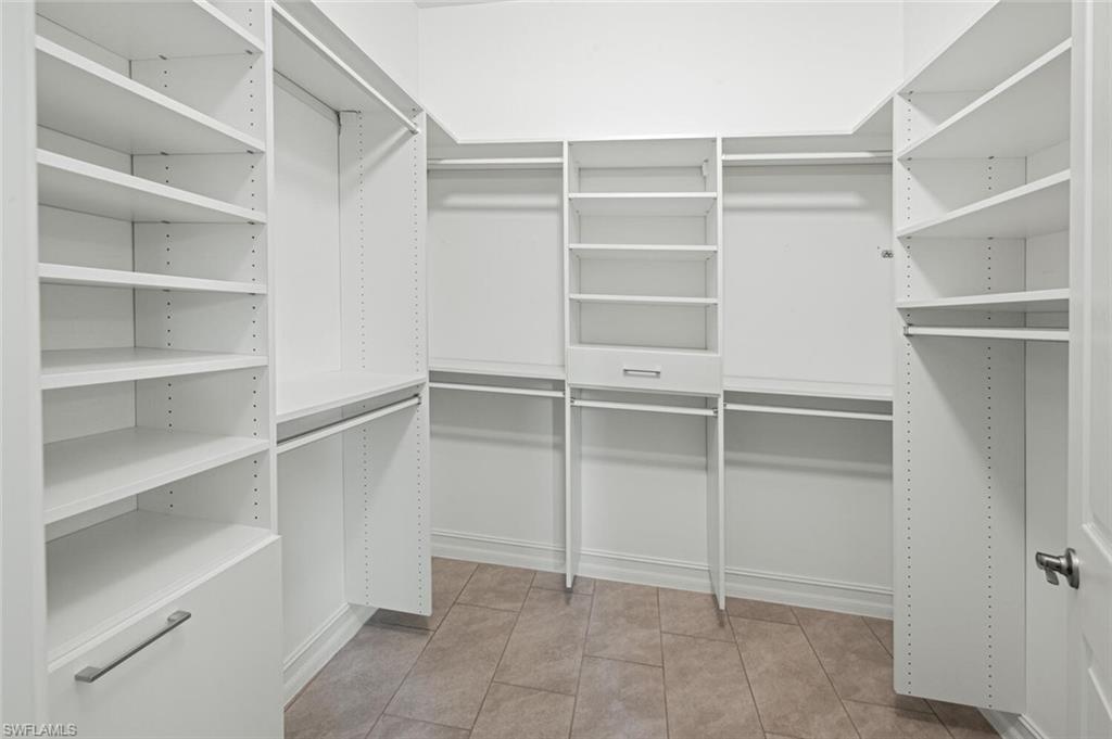 1488 Mockingbird Drive Naples, FL 34120 - Photo 17 of 38 a view of an empty walk in closet
