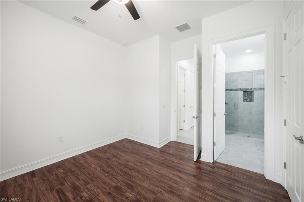 1488 Mockingbird Drive Naples, FL 34120 - Photo 21 of 38 wooden floor in an empty room