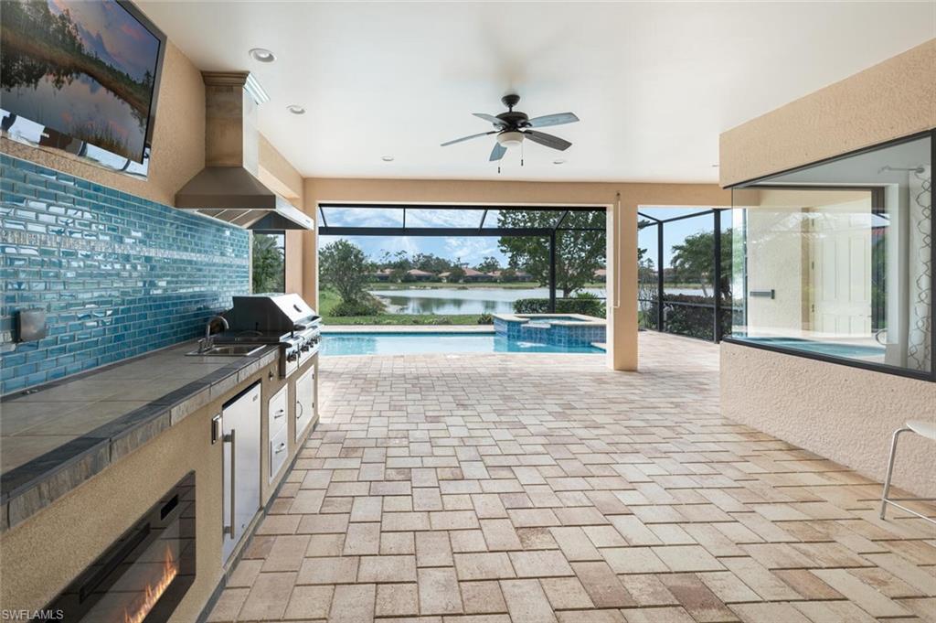 1488 Mockingbird Drive Naples, FL 34120 - Photo 25 of 38 a large white kitchen with a large window