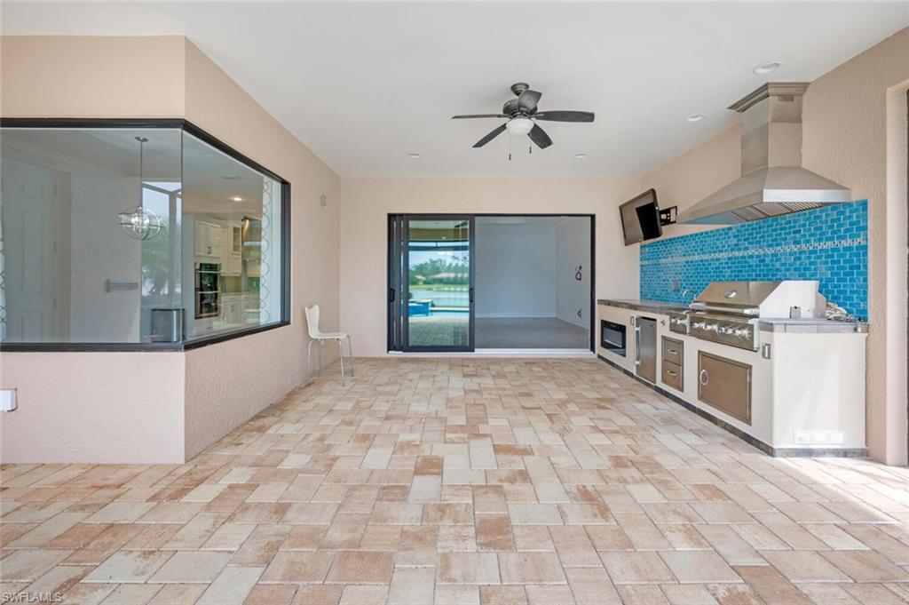 1488 Mockingbird Drive Naples, FL 34120 - Photo 27 of 38 a view of a kitchen with a sink and dishwasher kitchen view