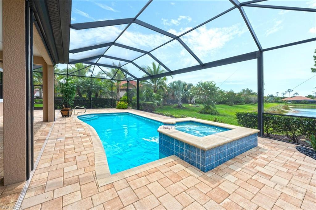 1488 Mockingbird Drive Naples, FL 34120 - Photo 28 of 38 a view of a swimming pool with a porch