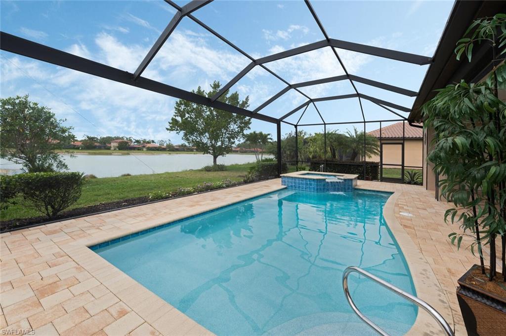 1488 Mockingbird Drive Naples, FL 34120 - Photo 29 of 38 a view of a swimming pool with a patio