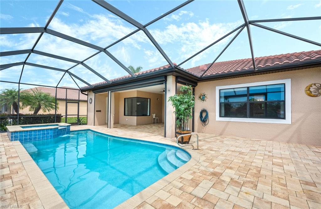 1488 Mockingbird Drive Naples, FL 34120 - Photo 32 of 38 a view of a house with a swimming pool