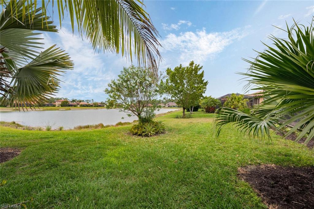 1488 Mockingbird Drive Naples, FL 34120 - Photo 33 of 38 a view of a yard and a palm tree