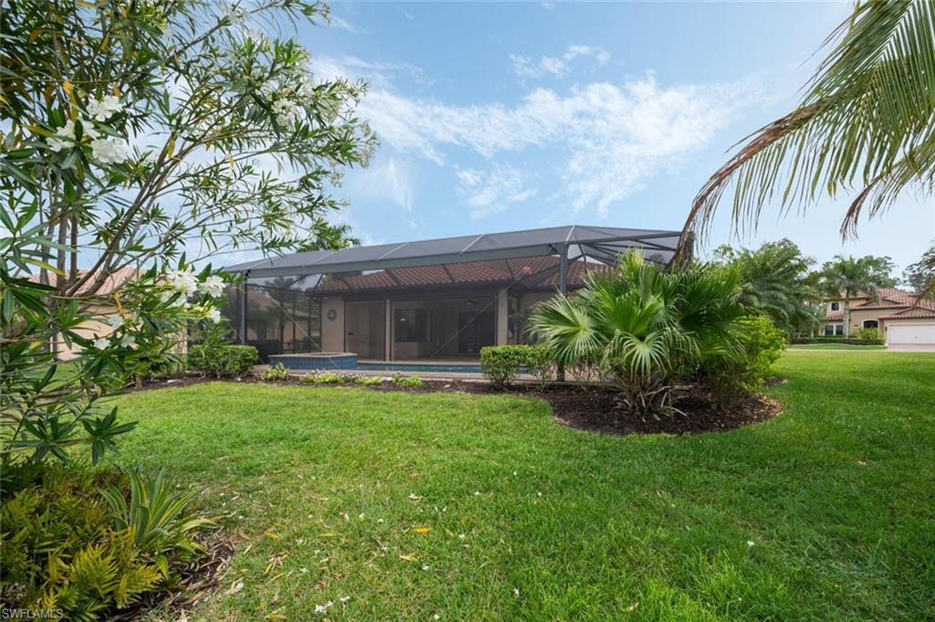 1488 Mockingbird Drive Naples, FL 34120 - Photo 35 of 38 a front view of a house with garden