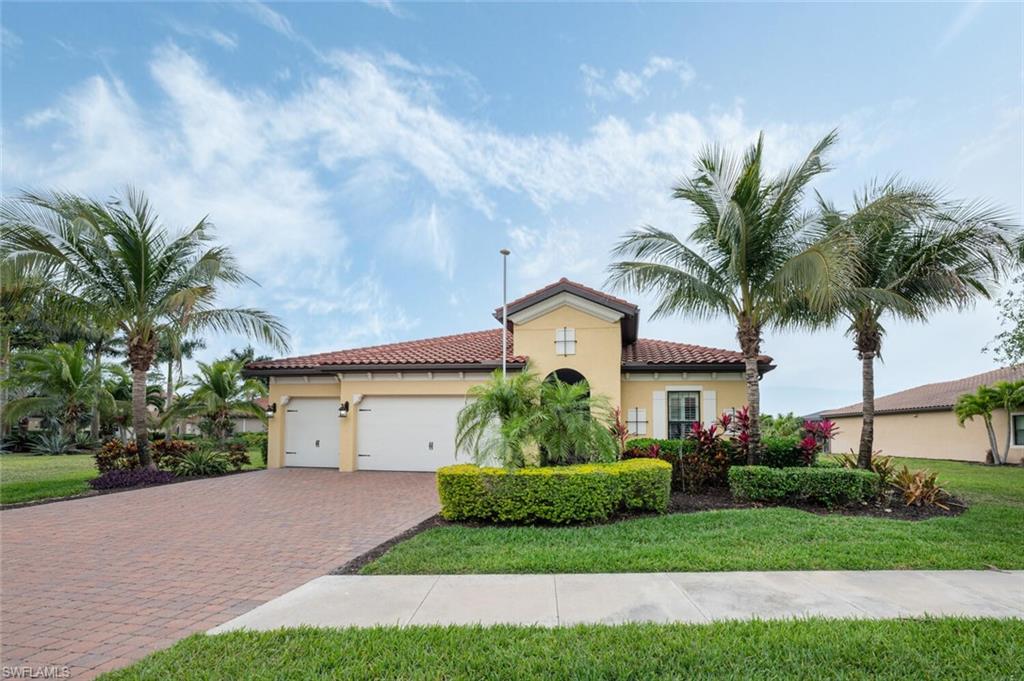 1488 Mockingbird Drive Naples, FL 34120 - Photo 38 of 38 a front view of house with yard and green space