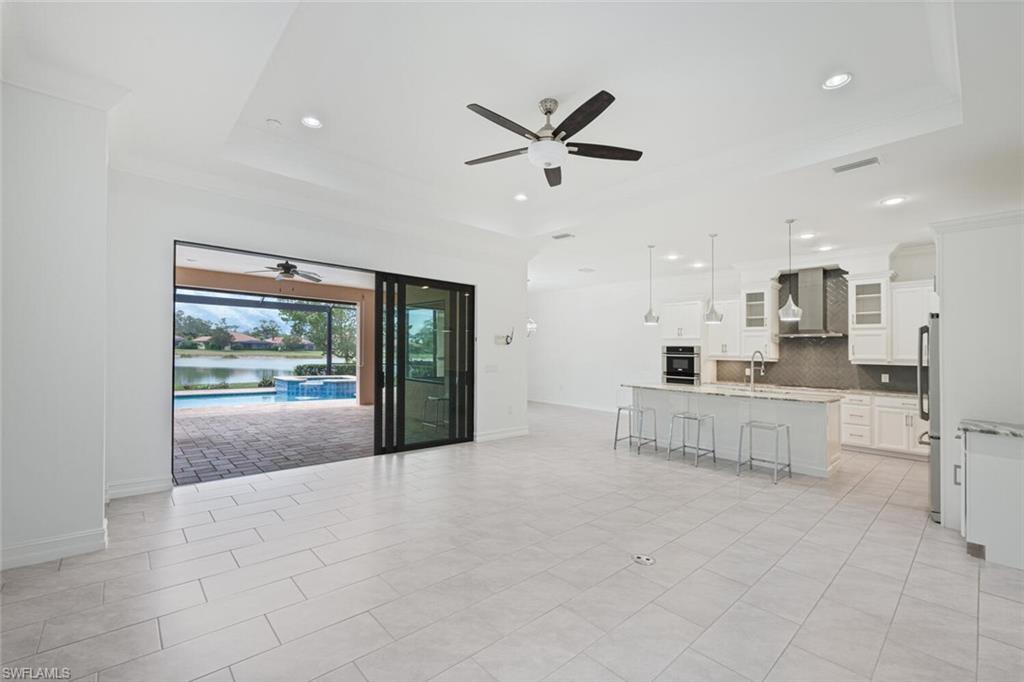 1488 Mockingbird Drive Naples, FL 34120 - Photo 5 of 38 a view of kitchen and windows