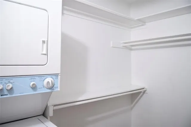 a view of an entryway with wooden floor and door