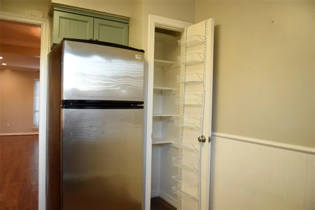 a bathroom with a shower and a glass door