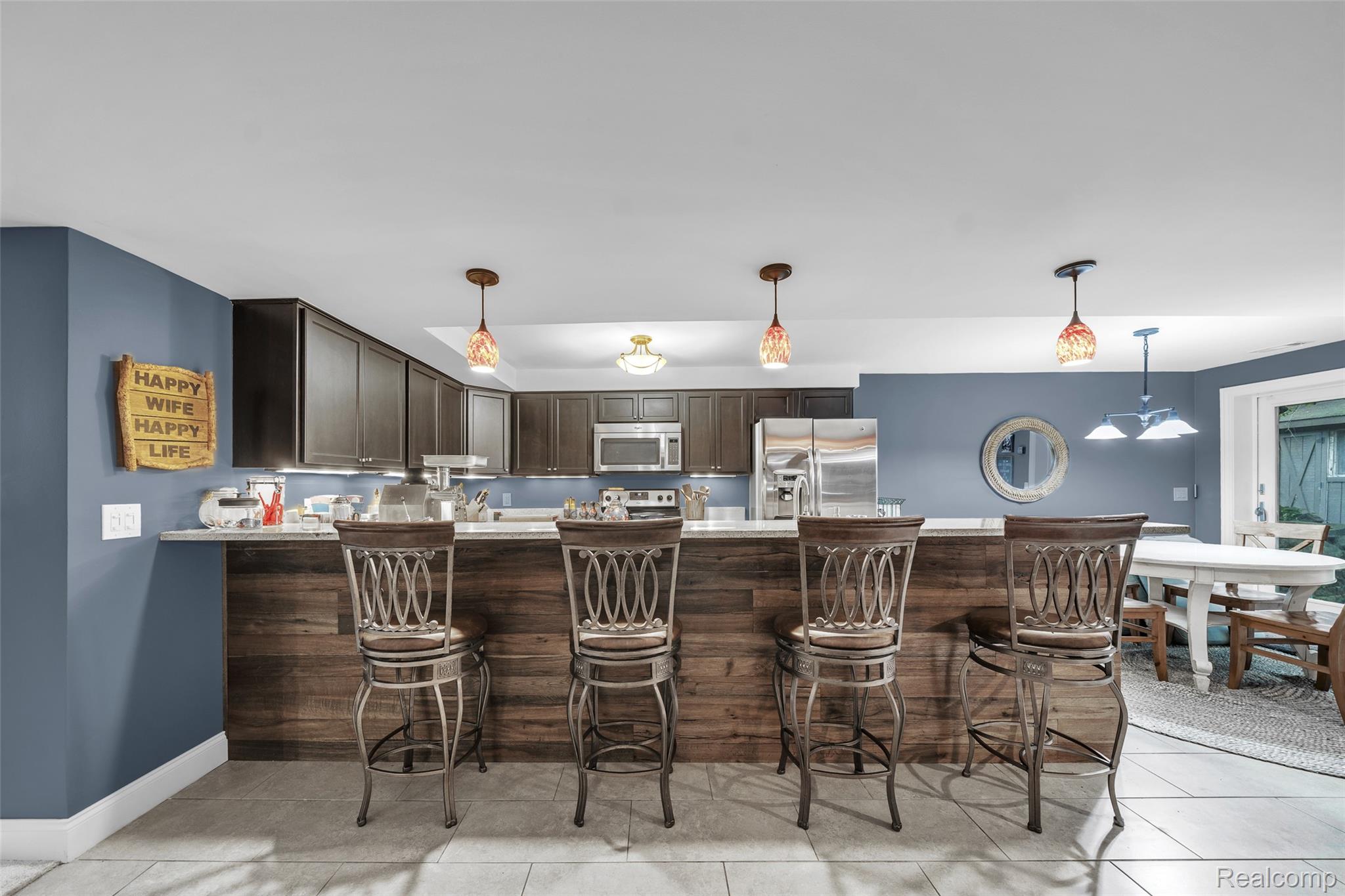 3985 South Ellamae Road Oakland, MI 48363 - Photo 37 of 64 3985-s-ellamae-rd-oakland-township-mi-usa_87 Lower level bar-kitchen area.jpg