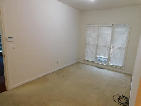 an empty room with window