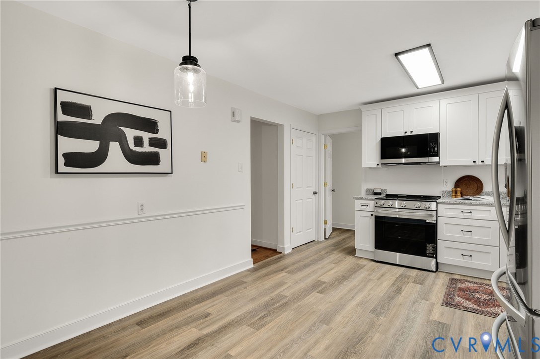 16430 St Peters Church Road Montpelier, VA 23192 - Photo 16 of 30 a kitchen with a stove and a refrigerator