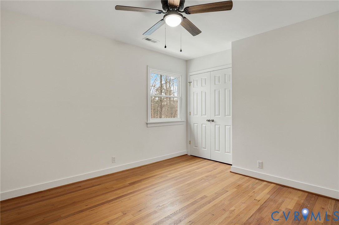 16430 St Peters Church Road Montpelier, VA 23192 - Photo 22 of 30 a view of an empty room with wooden floor and a window