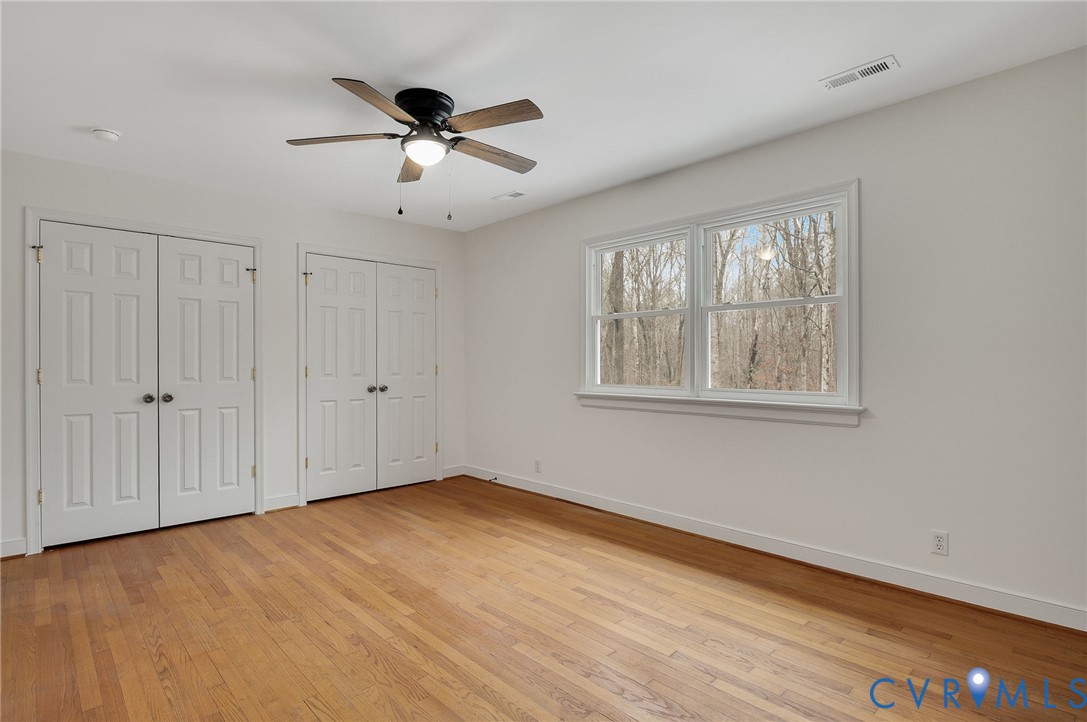 16430 St Peters Church Road Montpelier, VA 23192 - Photo 25 of 30 a view of an empty room with wooden floor and a window