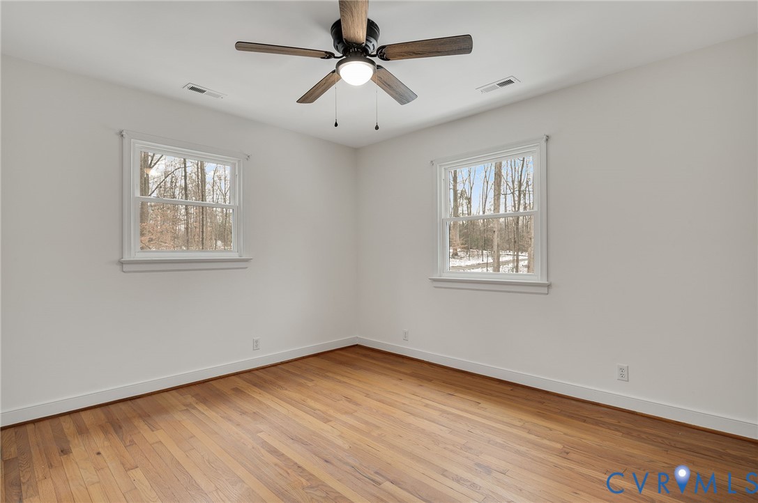 16430 St Peters Church Road Montpelier, VA 23192 - Photo 26 of 30 a view of empty room with wooden floor and fan