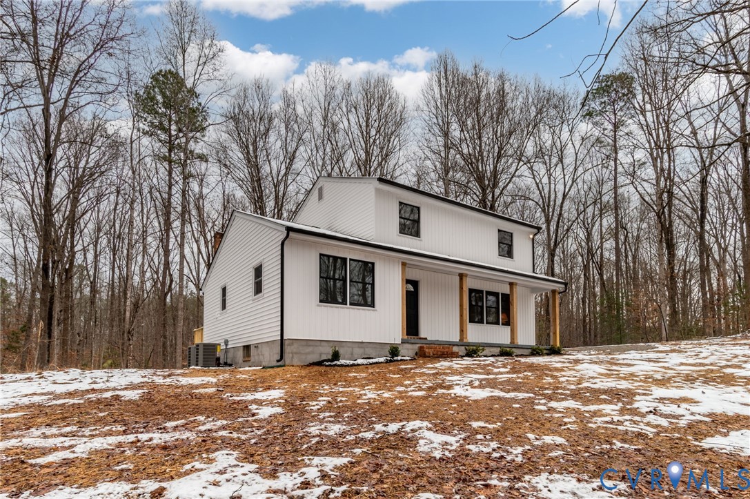 16430 St Peters Church Road Montpelier, VA 23192 - Photo 3 of 30 a view of a white house with a snow on the road