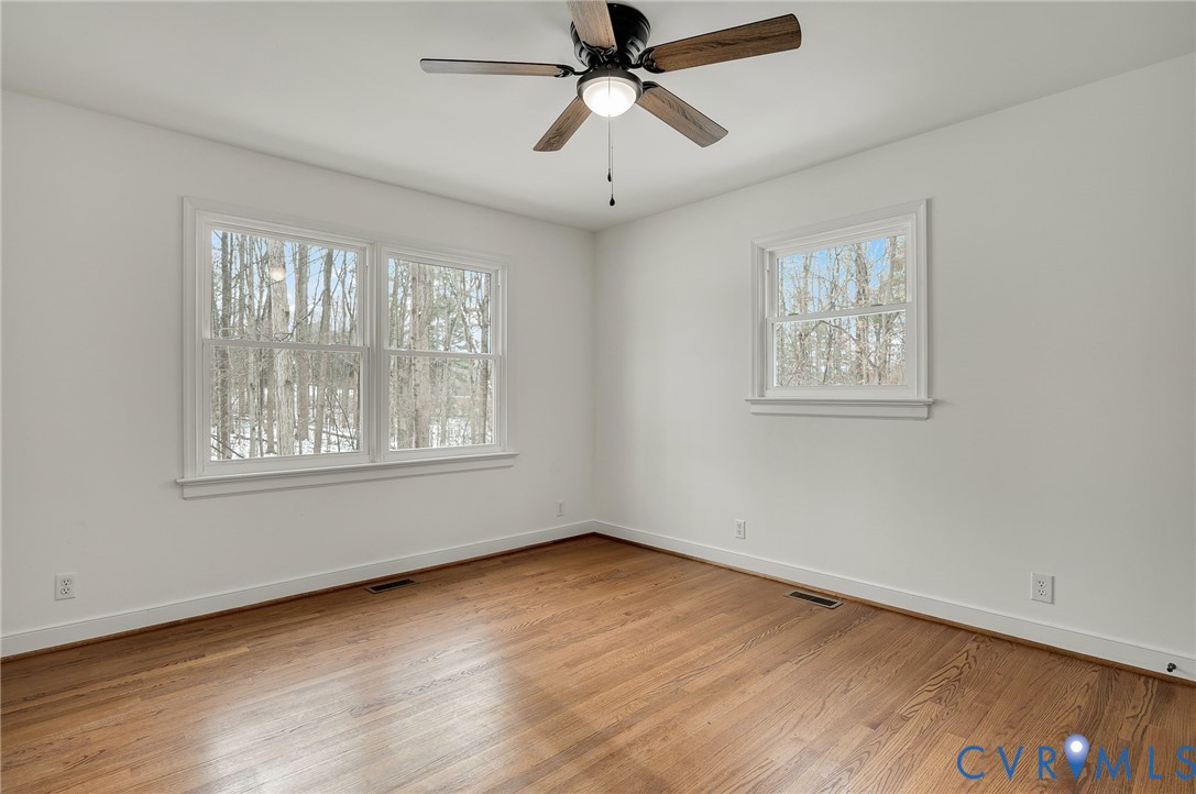 16430 St Peters Church Road Montpelier, VA 23192 - Photo 8 of 30 a view of an empty room with wooden floor and a window