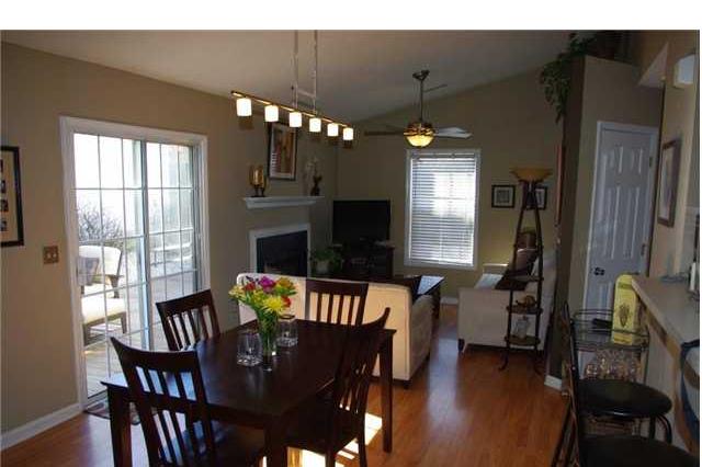 9015 Shallcross Way Raleigh, NC 27617 - Photo 3 of 12 a view of a dining room with furniture window and wooden floor