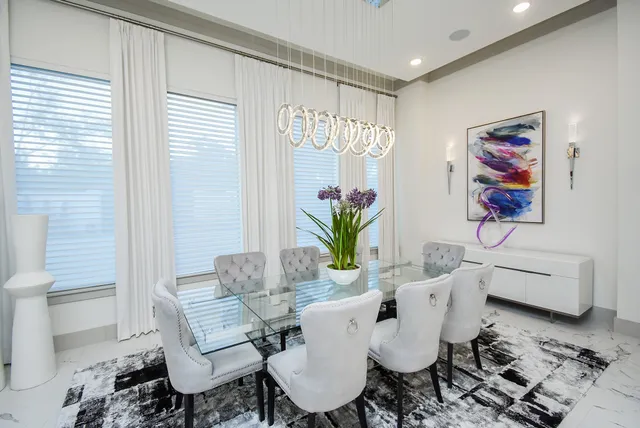 a living room with furniture potted plant and a lamp