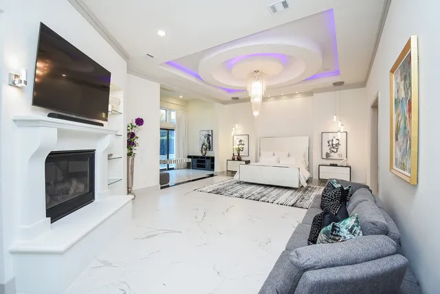 a kitchen with a stove a sink and a white wooden cabinets