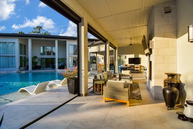a living room with fireplace furniture and a flat screen tv