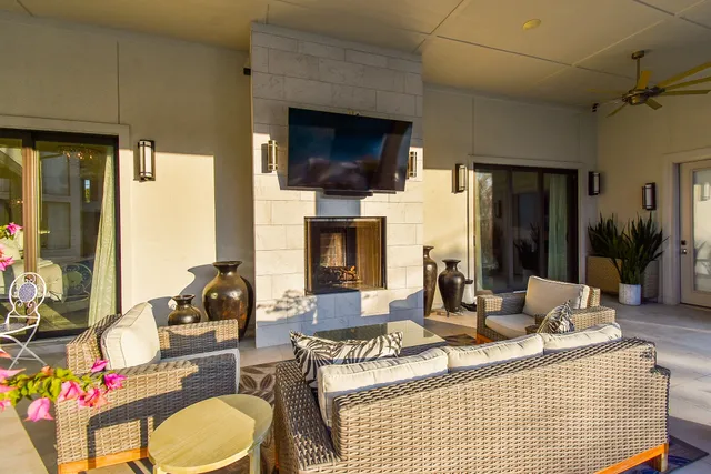 a view of swimming pool with outdoor seating