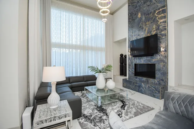 a view of a hallway with furniture