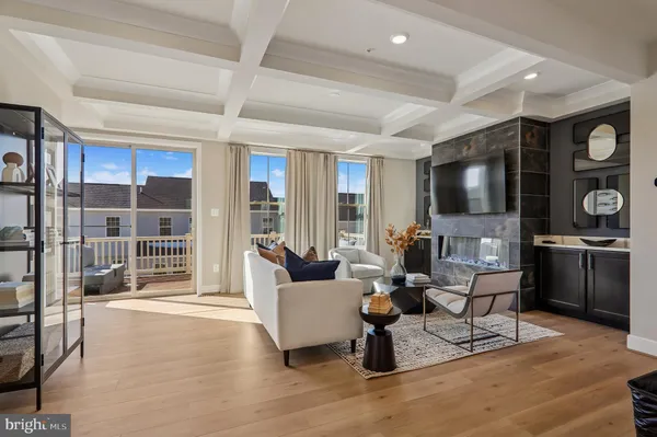 a living room with fireplace furniture and a flat screen tv