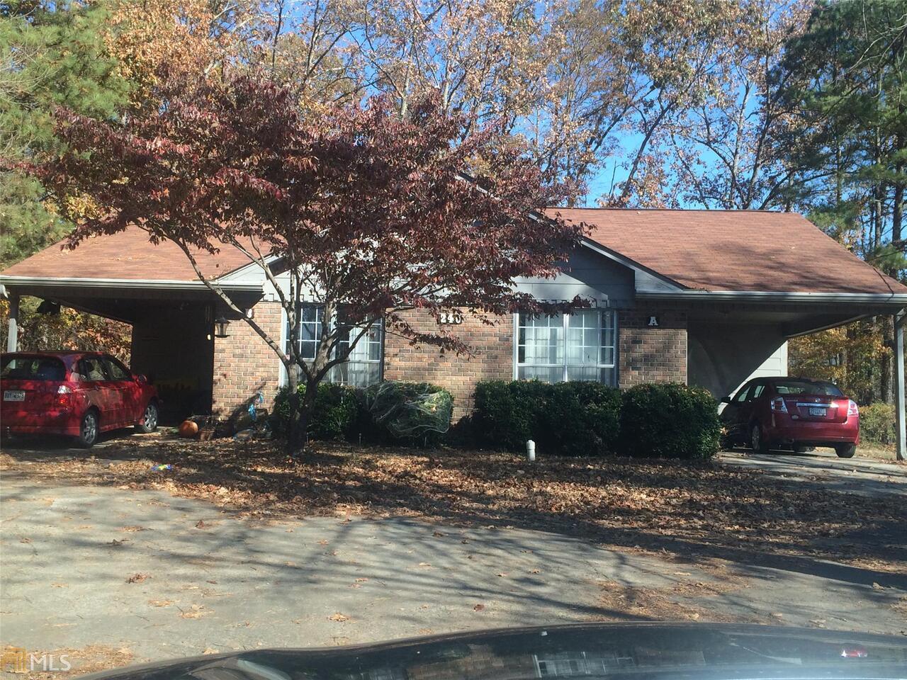 240 Huffaker Road Northwest, Unit A&B Rome, GA 30165 - Photo 1 of 1 a view of a house with a yard