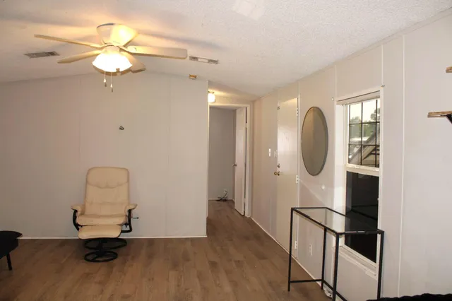 a room with a mirror and a window