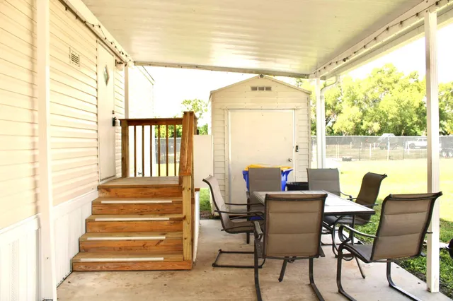 a dining room with wooden floor and a table