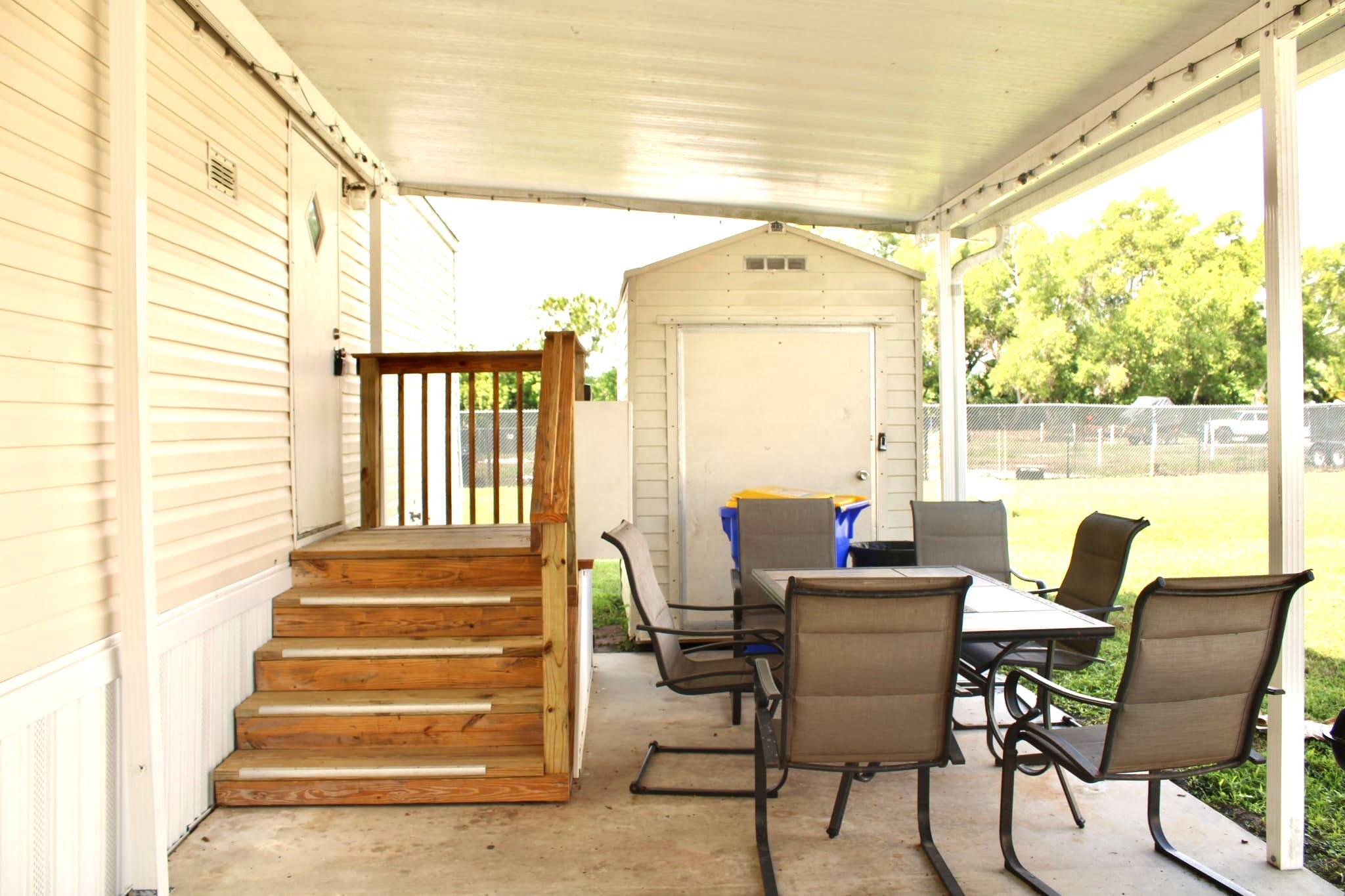5000 Southeast Federal Highway, Unit 806 Stuart, FL 34997 - Photo 3 of 22 a dining room with wooden floor and a table
