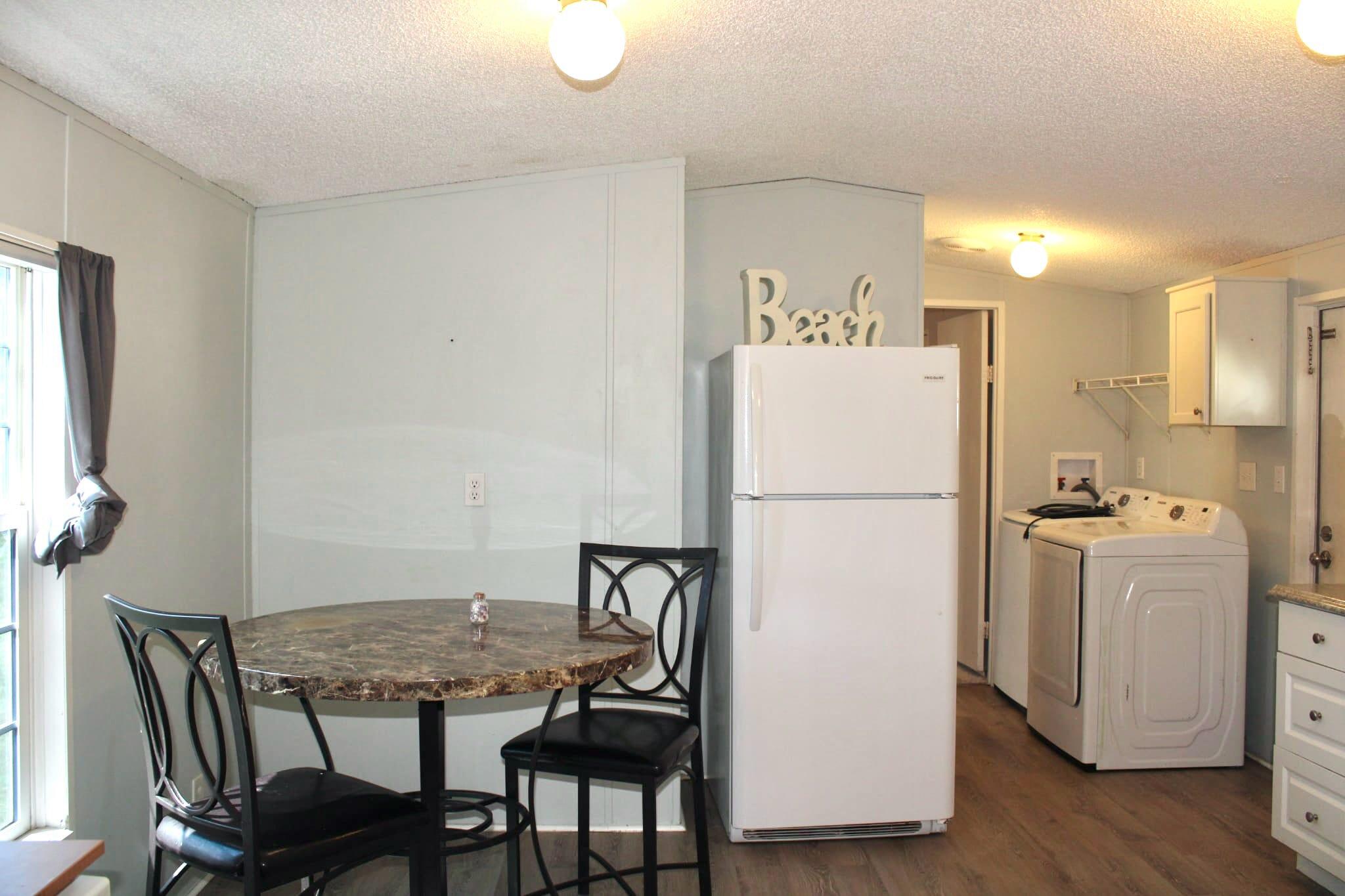 5000 Southeast Federal Highway, Unit 806 Stuart, FL 34997 - Photo 10 of 22 a white refrigerator freezer sitting next to a white cabinet
